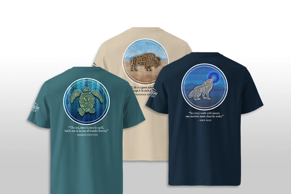 Earthlight Candle Co. shirts with sea turtle, bison, and wolf artwork